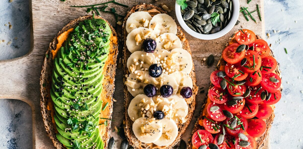 assorted fruits and vegetable on brown wooden chopping board