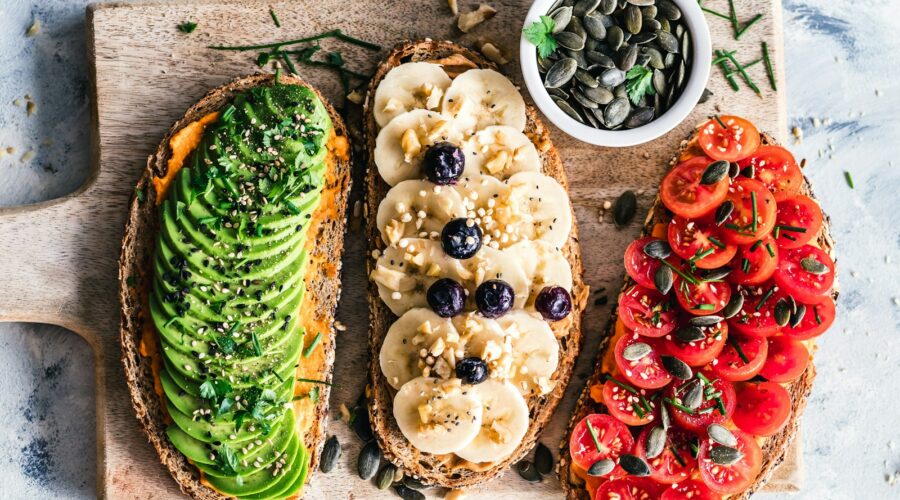 assorted fruits and vegetable on brown wooden chopping board