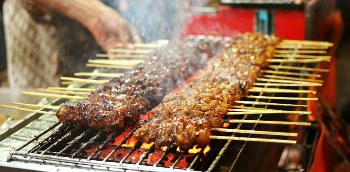 grilled meat on charcoal grill