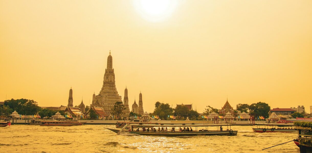 people walking on bridge over body of water during daytime