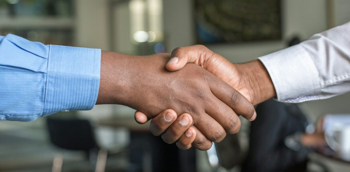 two people shaking hands