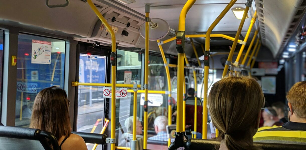 people sitting down inside vehicle