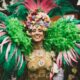 a woman in a green and pink costume