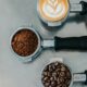 flat lay photography of coffee latte, ground coffee, and coffee beans