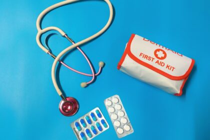 a bag of pills, a stethoscope, and a first aid kit