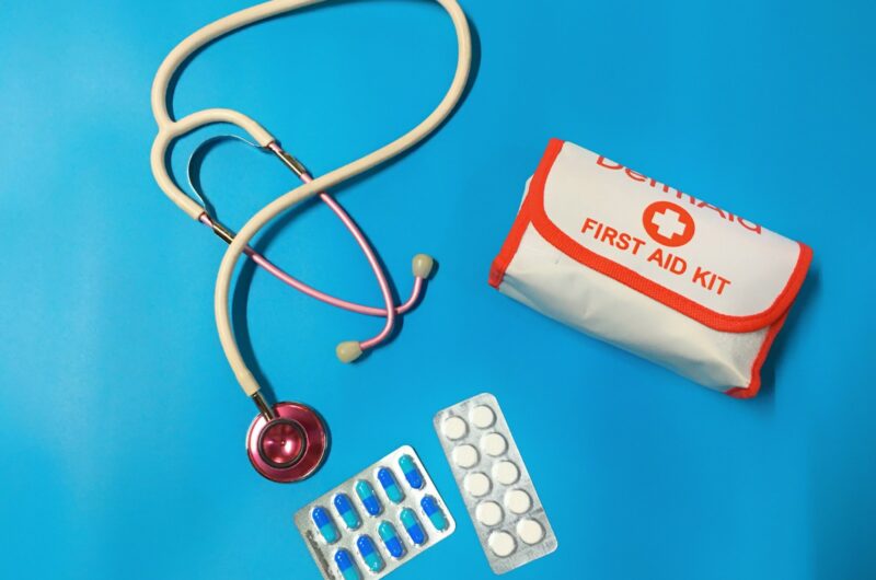 a bag of pills, a stethoscope, and a first aid kit