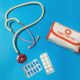 a bag of pills, a stethoscope, and a first aid kit